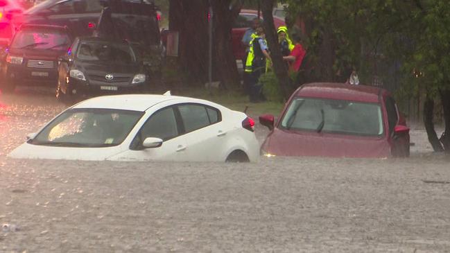 More cars run into trouble in the quickly-rising water on Colman St, Merrylands. Picture: TNV