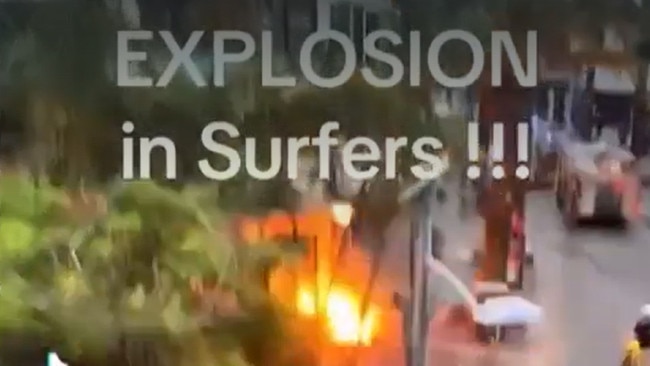 Footage posted to social networking site TikTok by account @Iris.Migadaki shows an explosive burst of fire from the footpath in Surfers Paradise