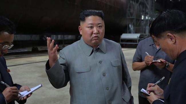 North Korean leader Kim Jong-un inspecting a newly-built submarine at an undisclosed location in 2019. Picture: KCNA via AFP