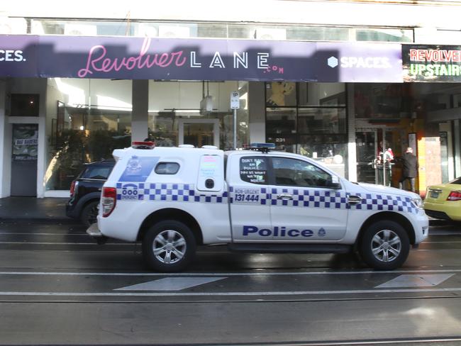 Police outside Revolver the day after the incident. Picture: David Crosling