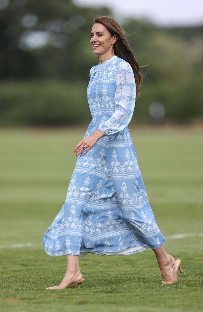July 6: Kate Middleton wore this long sleeved, full length baby blue and white dress featuring a cornflower print to the polo. Picture: Charlie Crowhurst/Getty Images