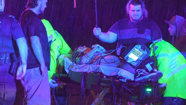 A teen on a stretcher with emergency services at the scene of a Molendinar crash. Picture: LLN Australia