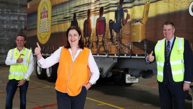 Queensland Premier Annastacia Palaszczuk and Agricultural Industry Development Minister Mark Furner, right, see off the kegs. Picture: Liam Kidston