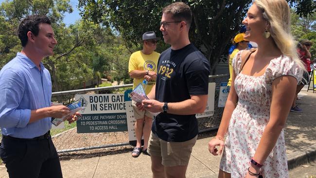 Bonney MP Sam O'Connor at the Arundel State School handing out votes during the State poll.