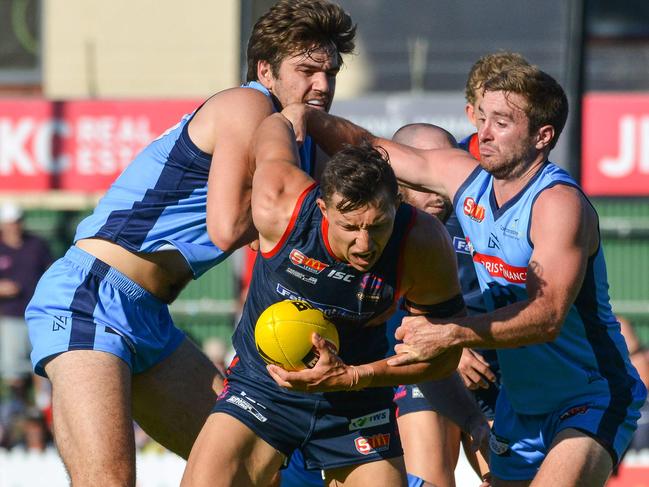 SANFL: Norwood v Sturt at Norwood Oval, Monday, April 2, 2018. Norwood's Patrick Levicki is tackled by Thomas Read and John Greenslade. (AAP Image/ Brenton Edwards)