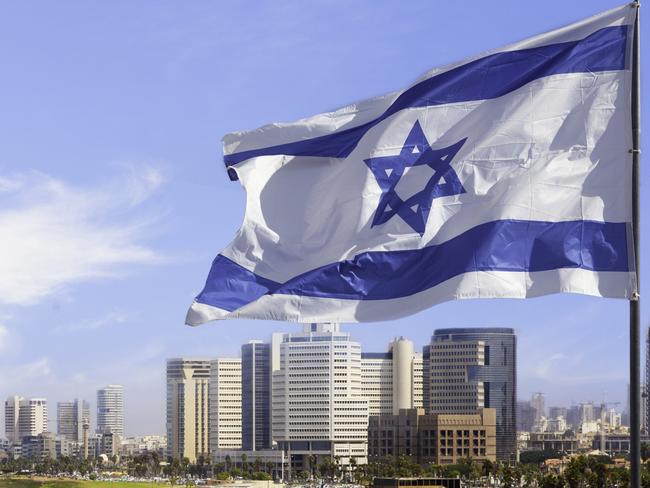 View of Tel Aviv beach in summer time with Israel Flag