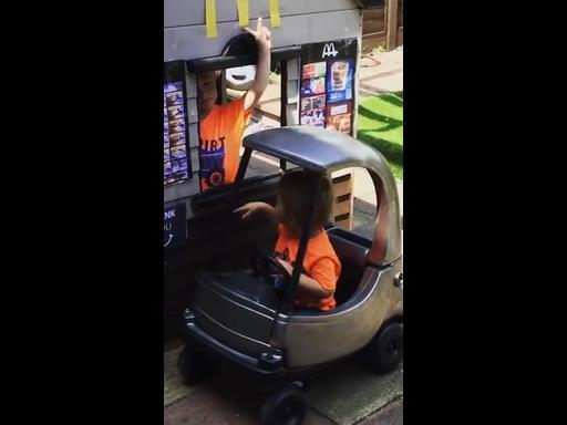 Dad creates Macca's drive-thru for kids using materials from skips