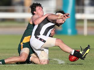 Paul Munce (Reynella) is tackled by Dean Conier (Marion) during the third quarter. Marion v Reynella, at Club Marion. Southern Football League. 06/05/17  Picture: Stephen Laffer