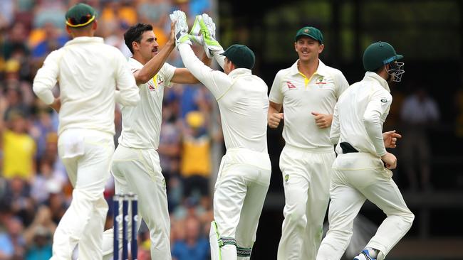 Mitchell Starc celebrates after taking the wicket of Dawid Malan. Picture: Getty Images.