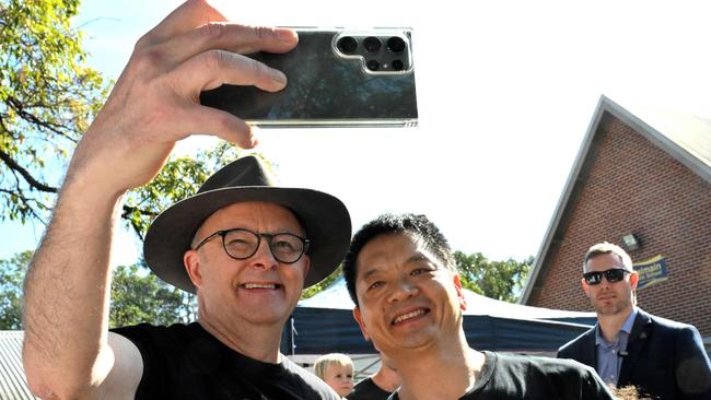 Prime Minister Anthony Albanese a selfie with a voter at Balmain Public School on referendum day. Picture: AFP