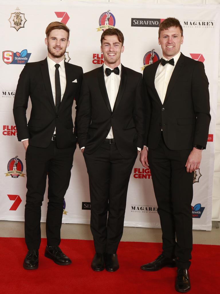 Jonty Scharenberg, Luke Partington and Luke Reynolds pose for a picture on the red carpet at Adelaide Oval in North Adelaide, for the Magarey Medal, Monday, September 9, 2019. Picture: Matt Loxton