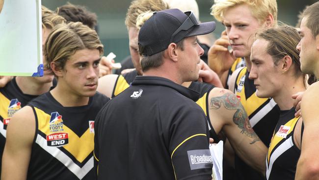 Brighton coach Joel Tucker addresses his players. Tucker said the Bombers’ win over St Peter’s OC on Saturday was its best since joining the league. Picture: AAP/Dean Martin