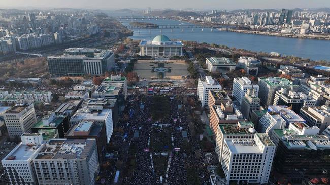 The opposition declaring the impeachment a "victory of the people". Picture: Jung Yeon-Je/AFP