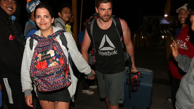 Australian Giovanna Ferraioli (L) and her partner Damien La Cava part of tourist evacuate from Gili Trawangan in Lombok to Bali. Picture: Lukman S Bintoro