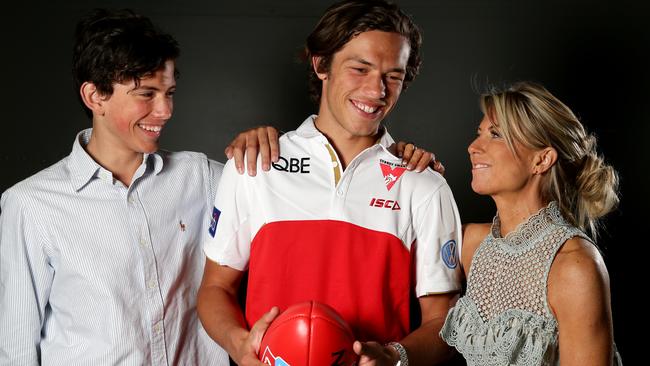 Oliver Florent with his brother Jai and mother Rachael after being drafted by Sydney. Picture: Jonathan Ng