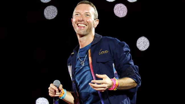 DAILY TELEGRAPH NOVEMBER 6, 2024. Chris Martin from Coldplay on stage at Accor Stadium at Sydney Olympic Park for their Music Of The Spheres World Tour concert. Picture: Jonathan Ng