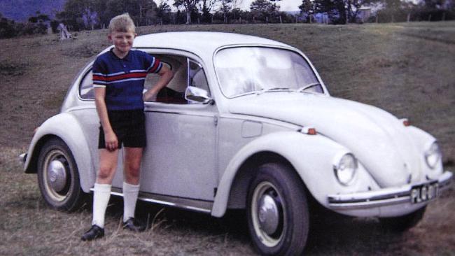 Kevin Rudd as a child in front of the Volkswagen in which he, his mother and sister slept following his fathers death.