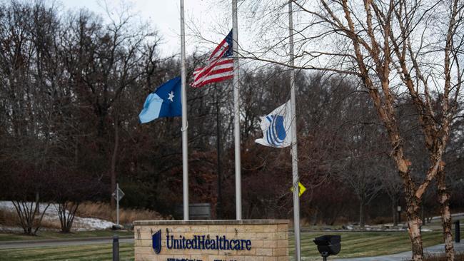 Flags fly at half mast outside the United Healthcare corporate headquarters on December 4 in Minnetonka, Minnesota. Picture: Stephen Maturen/Getty Images/AFP