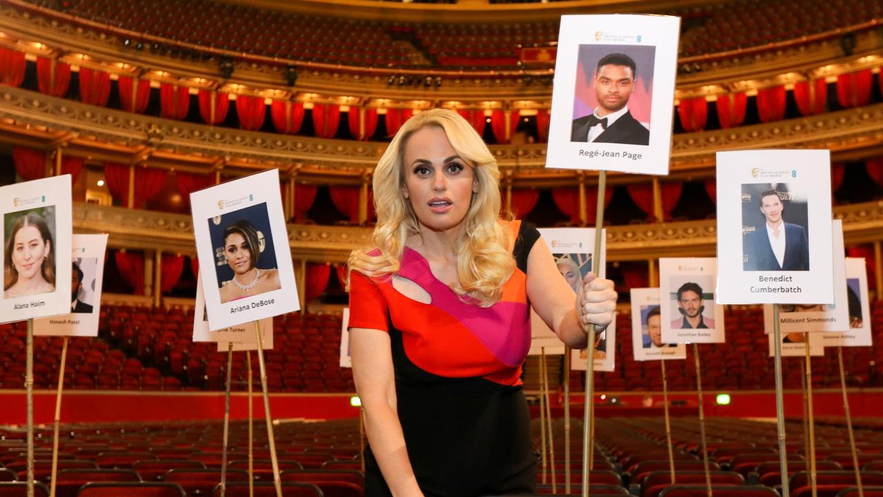 Wilson poses with heads on sticks used to arrange seat placings at the photocall ahead of the awards night. Picture: Tristan Fewings/Getty Images