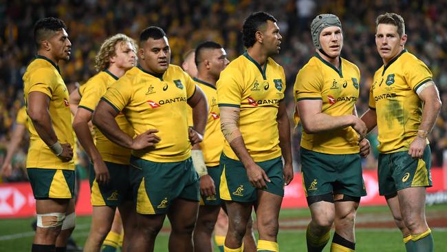 The Wallabies show their disappointment after the loss to Ireland.