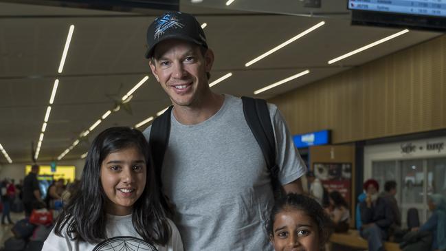 Myra Aggarwal 10 and Anvi Parekh 8 caught Tim Paine while departing Hobart at Hobart Airport. Picture: Caroline Tan