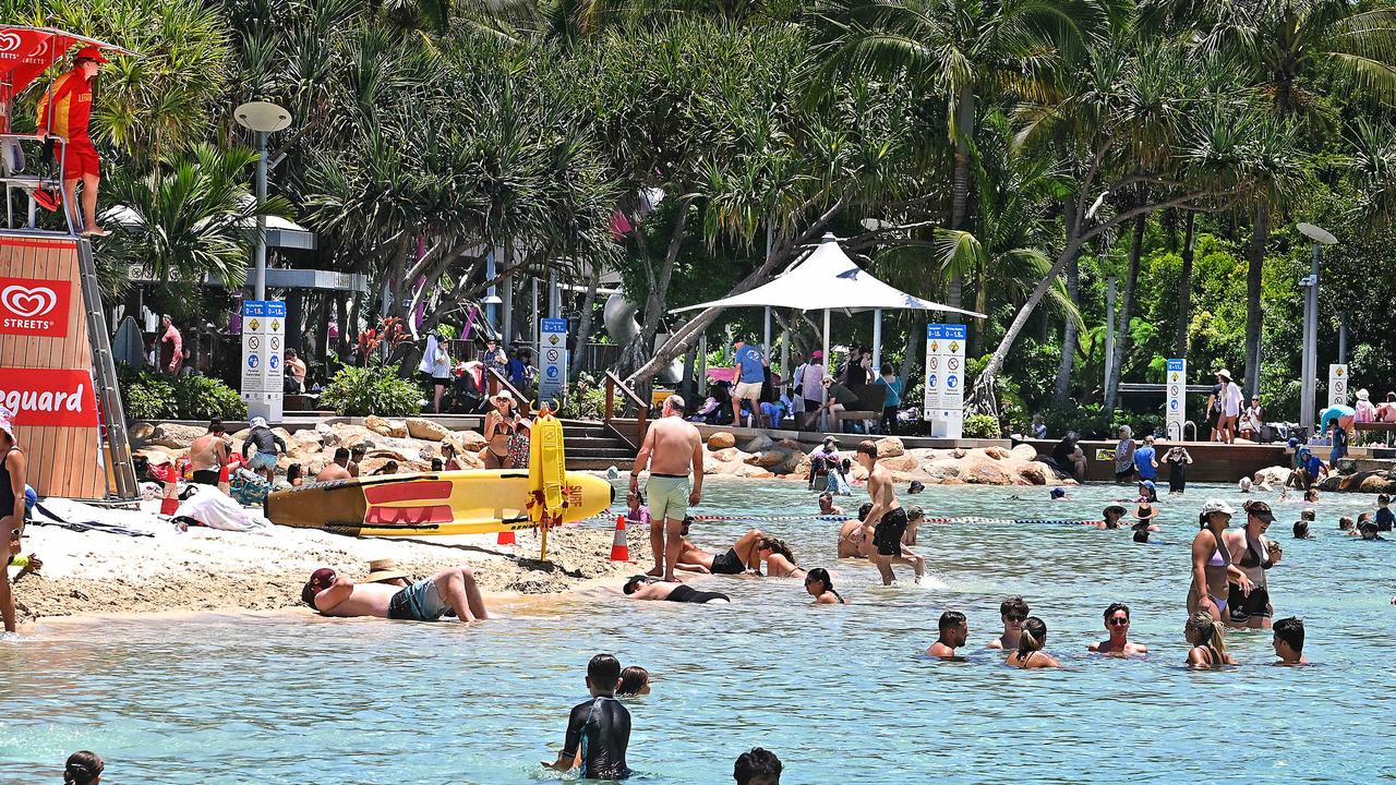 People enjoy some cool waters on a hot day at South Bank Parklands. Severe heatwaves are sweeping Queensland and NSW. Picture: NewsWire / John Gass