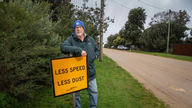 St Leonards resident Nick Martin stands next to a sign installed by the council in response to residents’ concerns about the roads. Picture: Brad Fleet