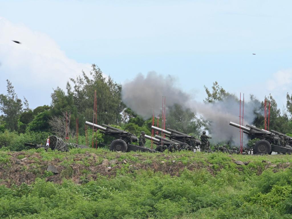 Taiwan military soldiers fire the 155-inch howitzers.