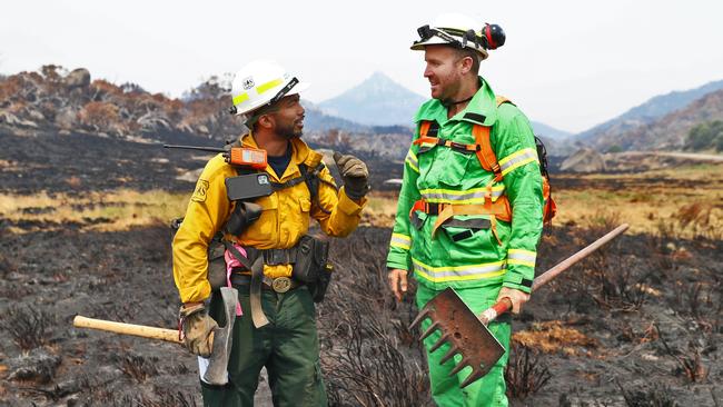 Specialist firefighter Leonard Dimaculangan from the US forest service with Luke Morrison from Forest Fire Management Victoria on top of Mt Buffalo. Picture: Aaron Francis