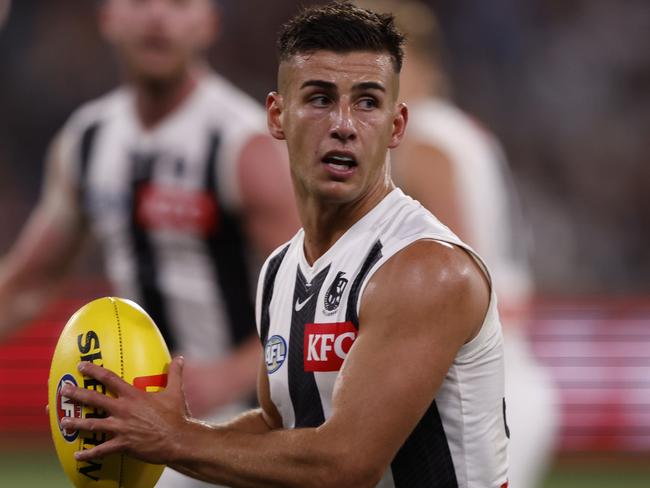 MELBOURNE, AUSTRALIA - MARCH 21: Nick Daicos of the Magpies runs with the ball during the round two AFL match between St Kilda Saints and Collingwood Magpies at Melbourne Cricket Ground, on March 21, 2024, in Melbourne, Australia. (Photo by Darrian Traynor/Getty Images)