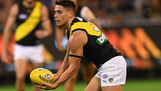 Dion Prestia of the Tigers in action.