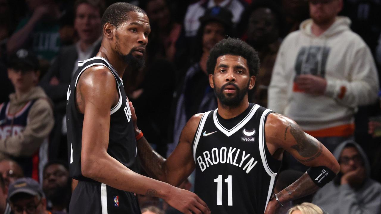 NEW YORK, NEW YORK - APRIL 23: Kevin Durant #7 and Kyrie Irving #11 of the Brooklyn Nets look on in the final seconds of their 109-103 loss against the Boston Celtics during Game Three of the Eastern Conference First Round NBA Playoffs at Barclays Center on April 23, 2022 in New York City. NOTE TO USER: User expressly acknowledges and agrees that, by downloading and or using this photograph, User is consenting to the terms and conditions of the Getty Images License Agreement. (Photo by Al Bello/Getty Images).