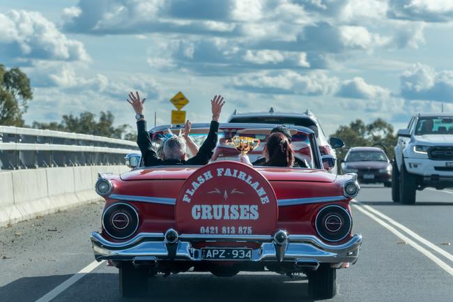 John Letts takes the Cup across the across the newly built Echuca-Moama bridge in a convertible.