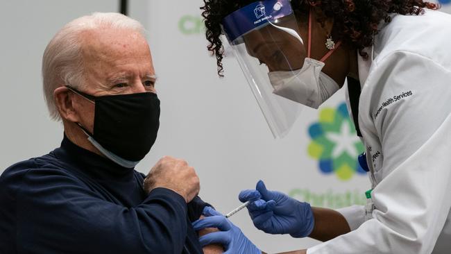 US President-elect Joe Biden receives a Covid-19 vaccination from Tabe Mase, Nurse Practitioner and Head of Employee Health Services, at the Christiana Care campus in Newark, Delaware.