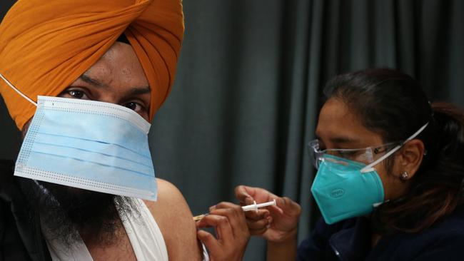 Registered nurse Shalini administers a Covid vaccine at the Australian Sikh Association pop-up clinic in Glenwood, in Western Sydney, on Thursday. Picture: Getty
