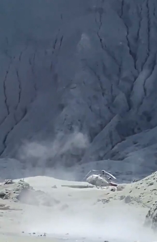 A helicopter left behind after the New Zealand White Island volcano eruption Picture: Michael Schade