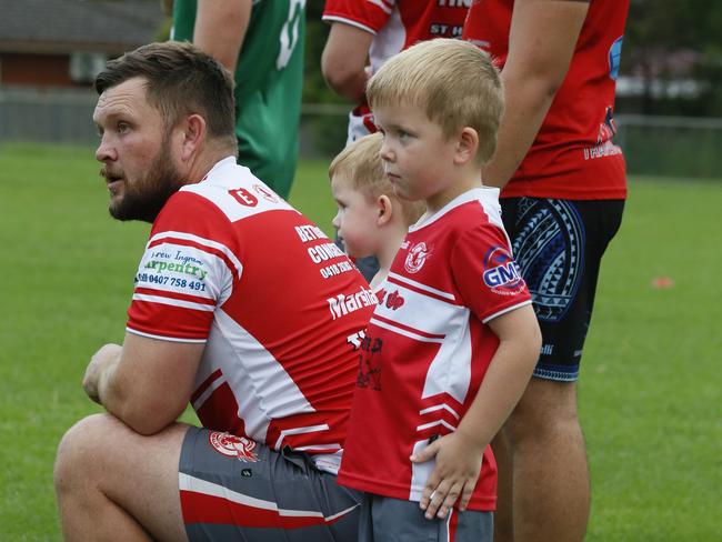 Family club: First grader Brett Lahey with the next generation of Eagles. Photo: Warren Gannon Photography