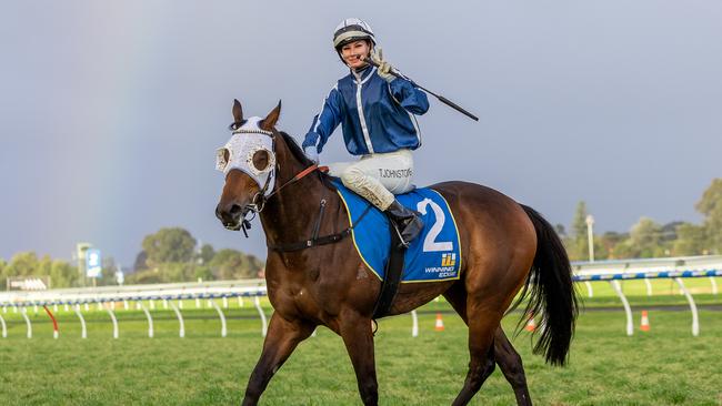 Taylor Johnstone celebrates a double aboard Winning Revolution. Picture: Makoto Kaneko