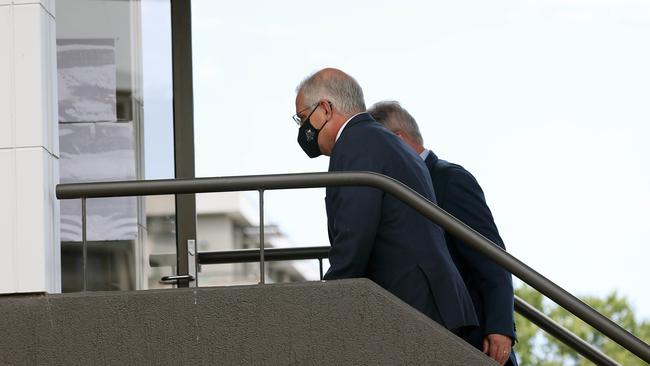 Mr Morrison had to be ushered in the back entrance after protesters swarmed the building. Picture: NCA/ Gary Ramage