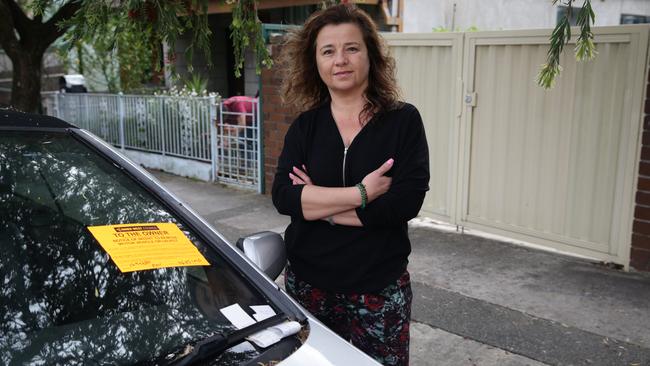 Katrina Gulabovski in front of her house with the car blocking her driveway. Picture: Craig Wilson
