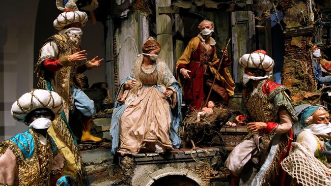 A nativity scene with Covid-era figurines at a shop on via San Gregorio Armeno, Naples. Picture: Reuters