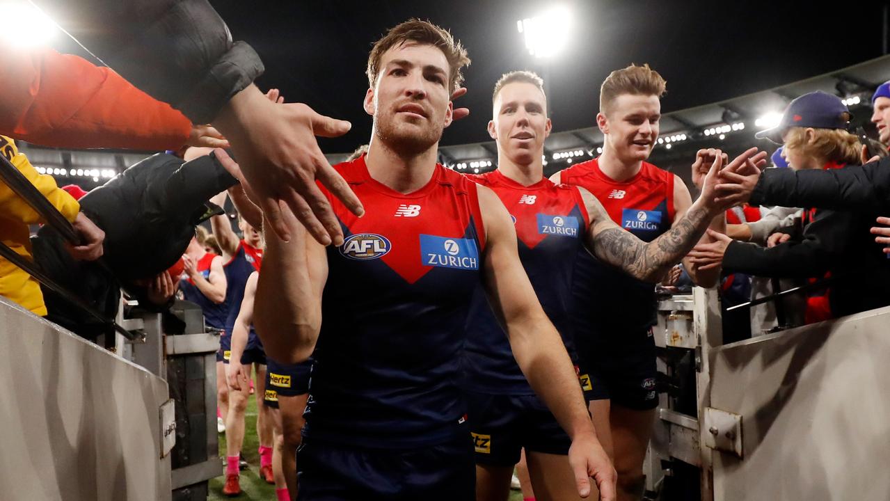 MELBOURNE, AUSTRALIA - JUNE 23: Jack Viney of the Demons celebrates with fans as they leave the field during the 2022 AFL Round 15 match between the Melbourne Demons and the Brisbane Lions at the Melbourne Cricket Ground on June 23, 2022 in Melbourne, Australia. (Photo by Dylan Burns/AFL Photos via Getty Images)