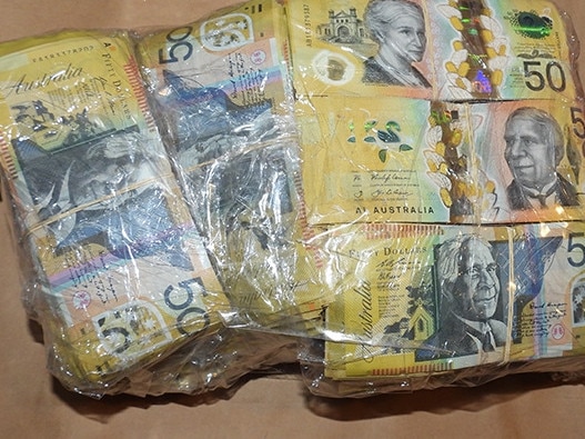 Wads of cash were found under the AFP-led Operation Ironside. Picture: AFP