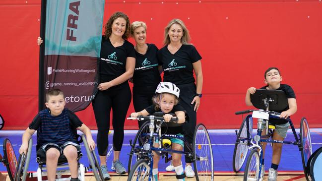 Frame Running Wollongong co-founders Sian Napper, Suzy Lock and Renee Jurgielan with Jacob Balazs, Pippa Napper and Ashton Binskin.