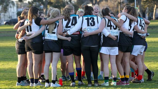 Pictures of both boys and girls playing football will be included in classrooms. Picture: Andy Rogers