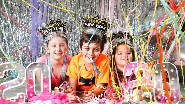 Little revellers Madeleine Daley, 6, Mason Daley, 6, and Georgina Neil, 5 at Portside Wharf. Photo: Claudia Baxter