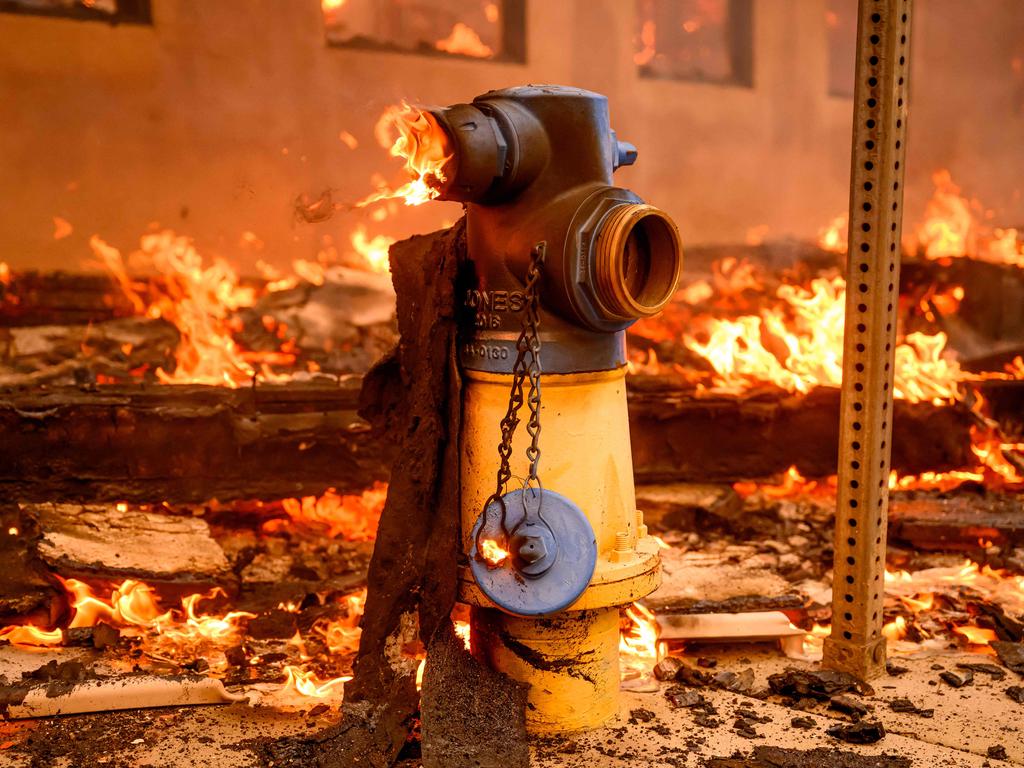 The fires continue to ravage large swathes of Los Angeles County, including several luxury estates occupied by A-list celebrities. Two people have already died and authorities expect the toll to rise. Picture: OSH EDELSON / AFP