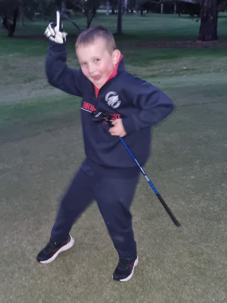 SA Little Legend Oscar Anderson, 8, pictured at the Valley View Golf Course, after winning the ‘$5 game’ when he landed the ball onto a $5 note placed on the green by his coach. Picture: Supplied.