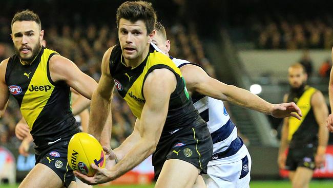 Trent Cotchin leads the Tigers forward against the Cats. Picture: Mark Stewart