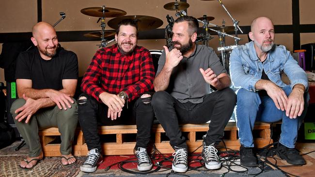 All smiles again … The Butterfly Effect band members, from left, Kurt Goedhart, Clint Boge, Ben Hall and Glenn Esmond. Picture: NCA NewsWire / John Gass